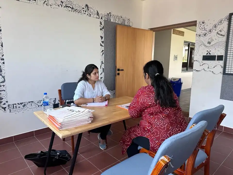 Megha in a one-to-one nutrition consultation with a client